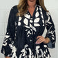 V-neck top with floral print, flared sleeves, and ruffle hem. Spring offer – 49% off