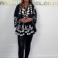 V-neck top with floral print, flared sleeves, and ruffle hem. Spring offer – 49% off