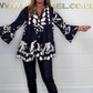 V-neck top with floral print, flared sleeves, and ruffle hem. Spring offer – 49% off